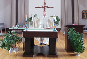 Fr. Peter in Chapel celebrating Mass.