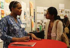 Two women talk and network on the Cantellops Art Gallery during La Roche University’s Business Etiquette Dinner.