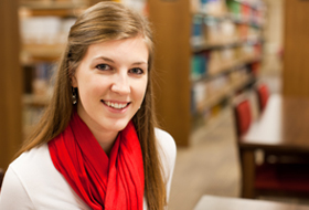 Female tutor at La Roche University sitting in Wright Library.