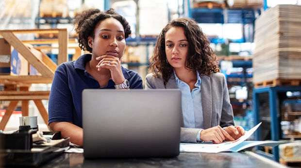 Two proffesionals working in a supply change management setting