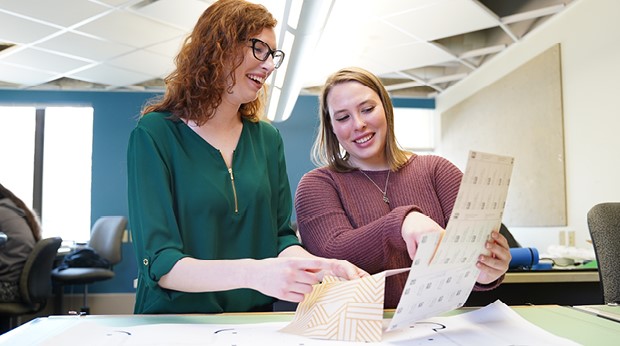 Design faculty and student in the classroom