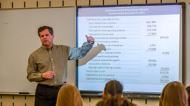 Professor and students in finance class