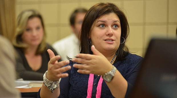 A La Roche University graduate student talks in a classroom.