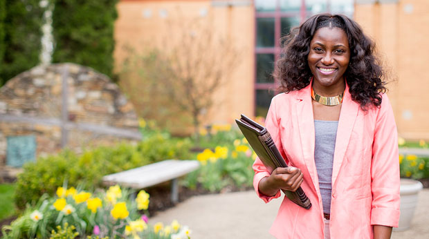 Student smiling in outdoor setting