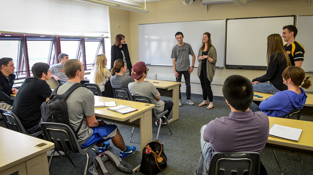 Students giving presentation in La Roche classroom