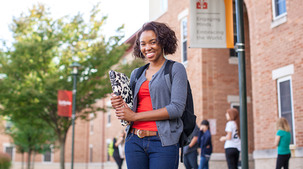 Female student standing outside of Bold Hall