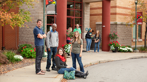 Group of La Roche University students hanging out in front of Kerr Fitness & Sports Center