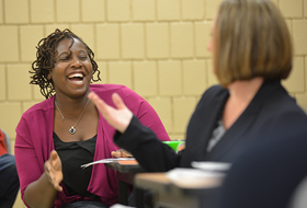 Adult students interacting in class