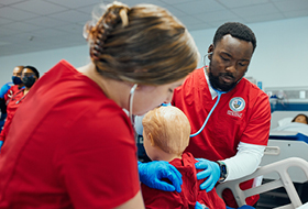 Nursing students working in the simulation lab