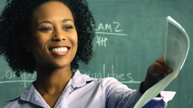 Teacher instructing in front to classroom