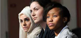 Three female International Students sitting in College Square