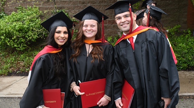 Graduates in cap and gown on LRU Campus