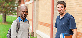 Two male student standing in front of Kerr Fitness Center