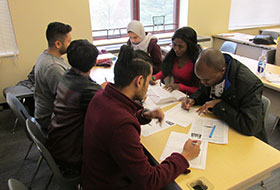 ESL students at desk in classroom