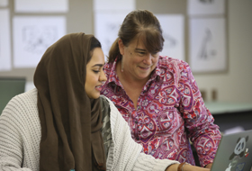 A La Roche University student and professor work closely in the classroom