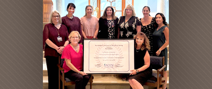 Nursing faculty and staff members pose in a chapel while two of them hold a framed accreditation certificate. Nursing faculty and staff members pose in a chapel while two of them hold a framed accreditation certificate.